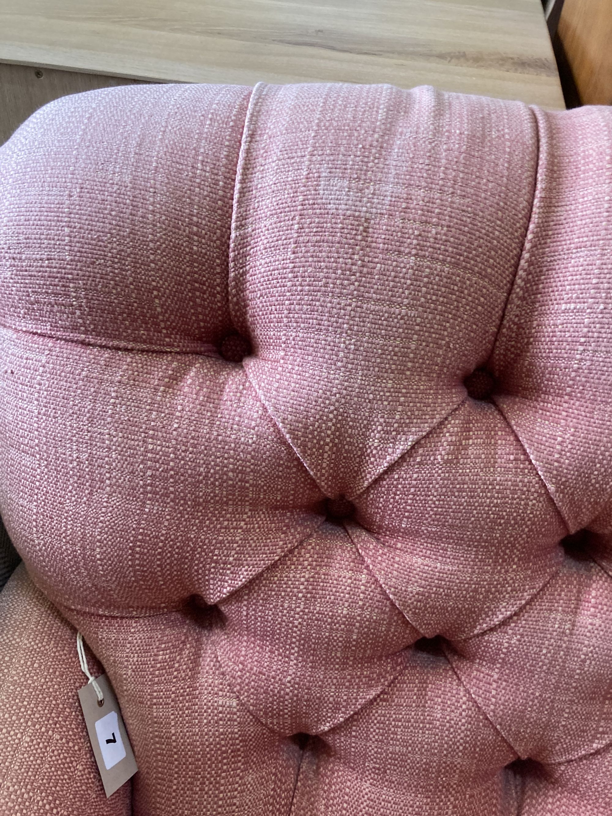 A contemporary buttoned upholstered armchair, length 80cm, depth 90cm, height 96cm